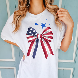 patriotic bow shirt, red white and blue bow tee, 4th of July shirt for women, cute USA graphic tee, American flag bow shirt, trendy patriotic outfit, women’s July 4th t-shirt