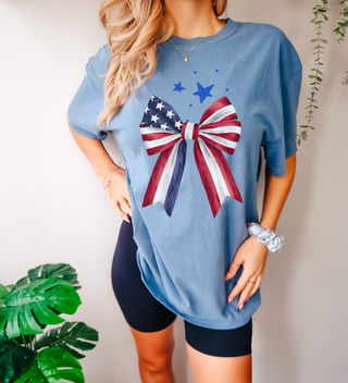 patriotic bow shirt, red white and blue bow tee, 4th of July shirt for women, cute USA graphic tee, American flag bow shirt, trendy patriotic outfit, women’s July 4th t-shirt