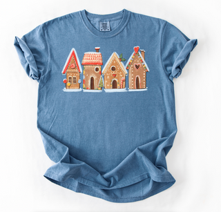 Blue t-shirt with gingerbread house design on a white background