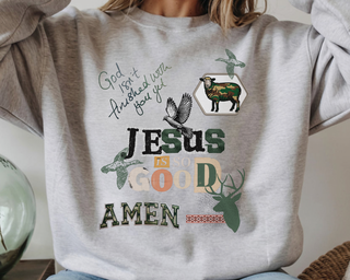 A woman wearing gray sweatshirt with Jesus Is So Good Text
