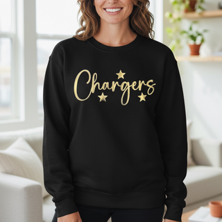 Person wearing a black sweatshirt with 'Chargers' printed in gold, standing in a bright room.
