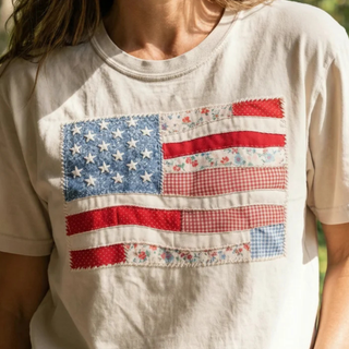 White t-shirt with a patchwork American flag design.