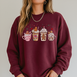 Maroon sweatshirt with festive coffee cup and gingerbread design on a plain background