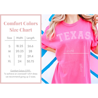 Pink t-shirt with 'TEXAS' text and size chart on a white background